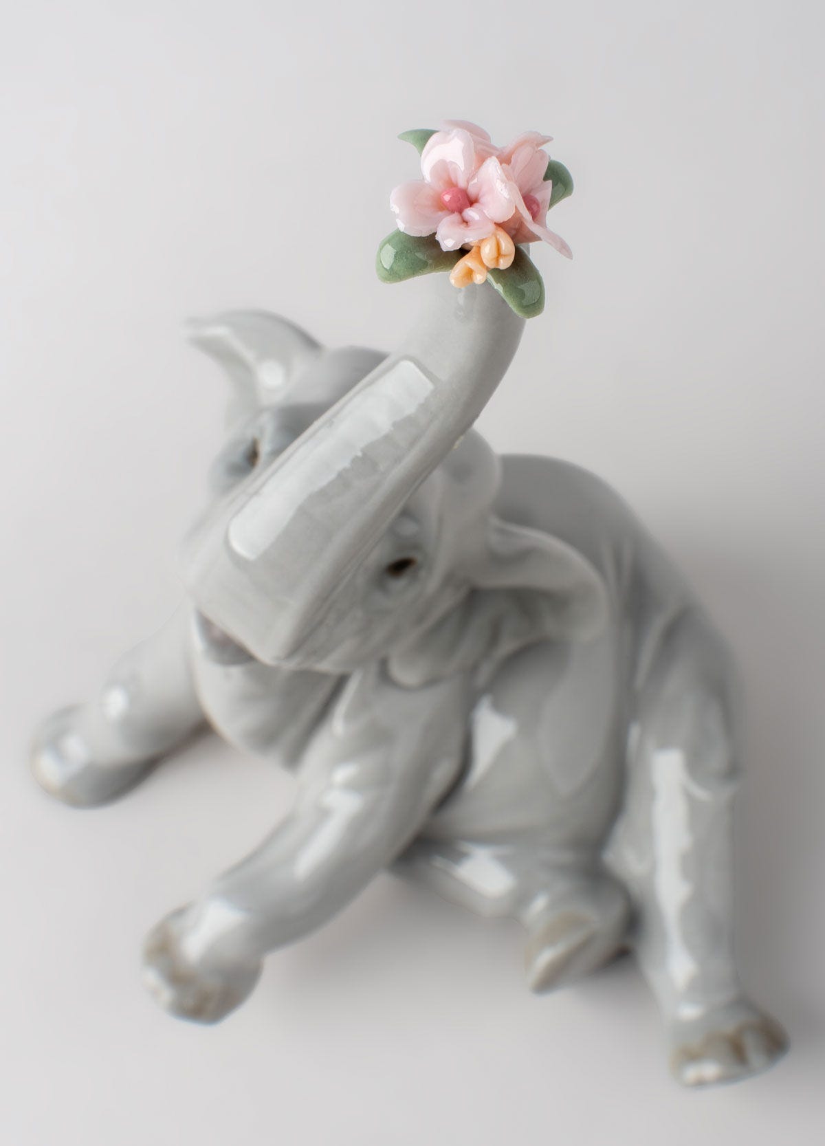 Baby Elephant with Pink Flower Figurine - Lladro-USA Baby Elephant with Pink Flower Figurine - Lladro-USA