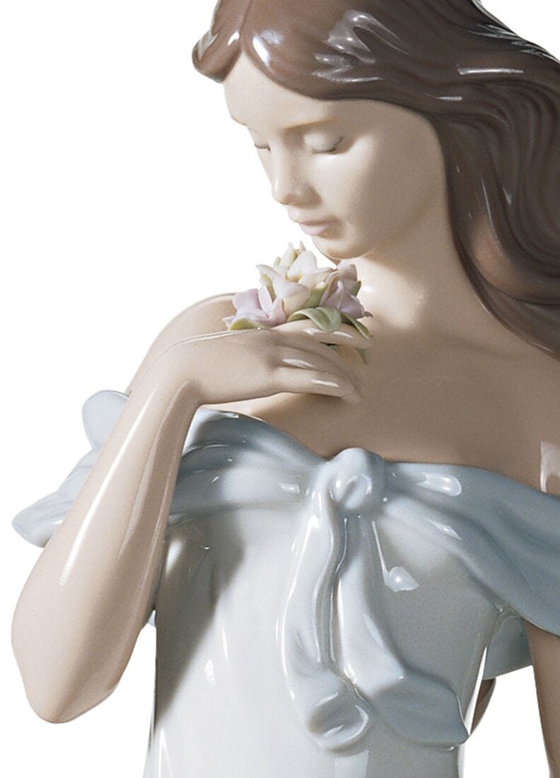 A Flower's Whisper Woman Figurine in Lladró