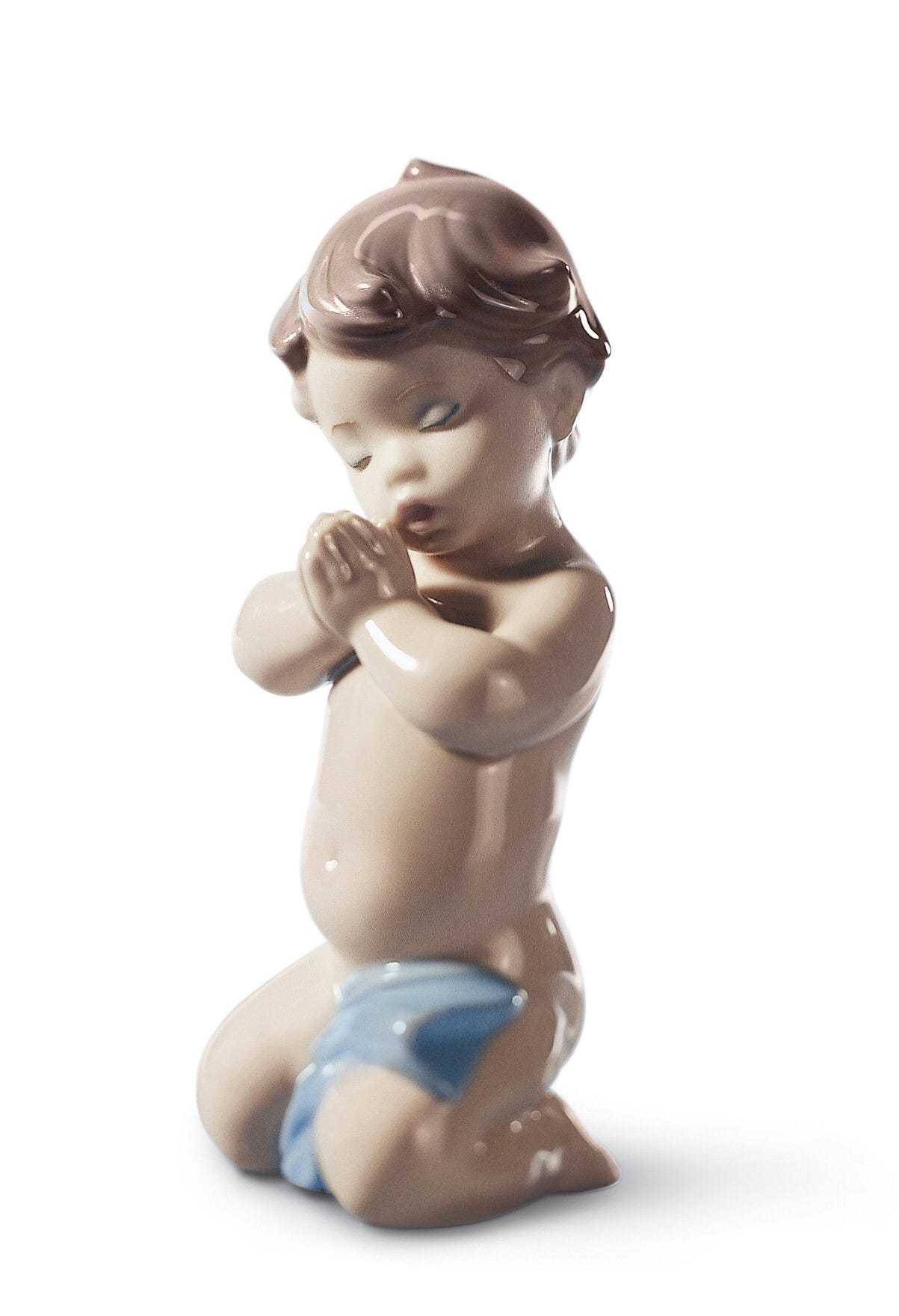Figurina di ragazzo di preghiera di un bambino