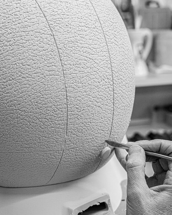 Finishing touches on porcelain sculpture