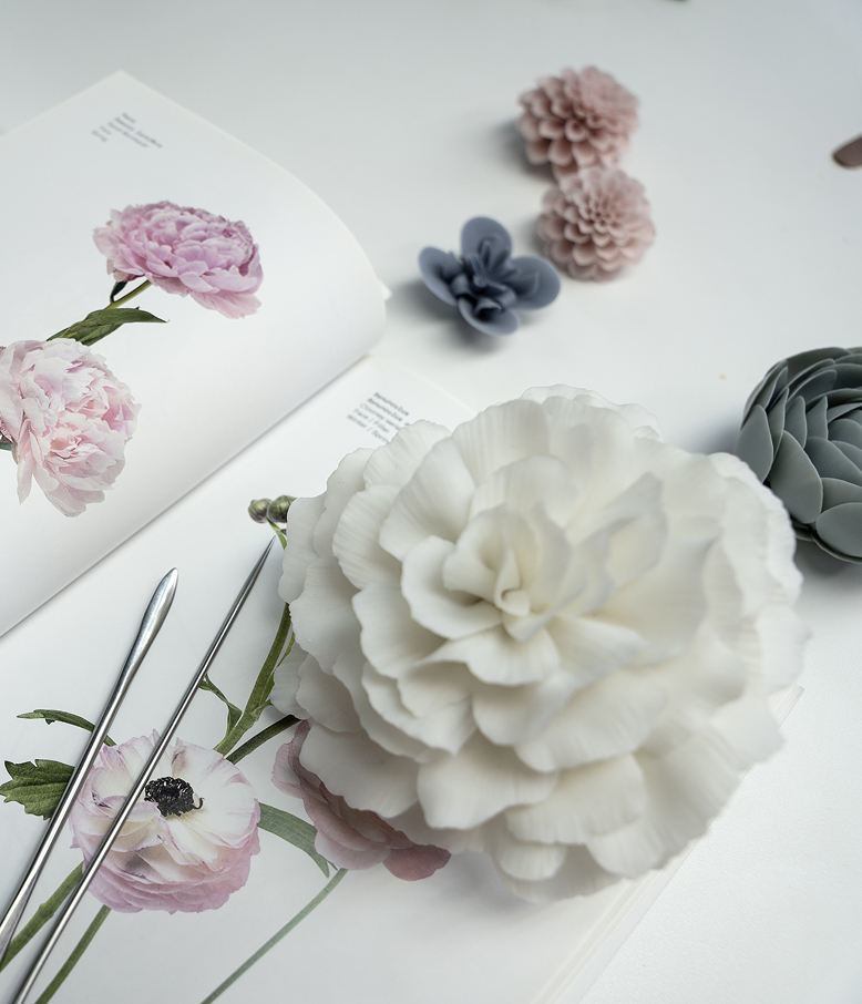 Hands that make porcelain bloom