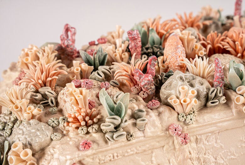 Side view of 'The Coral Car' installation showing sculptural composition
