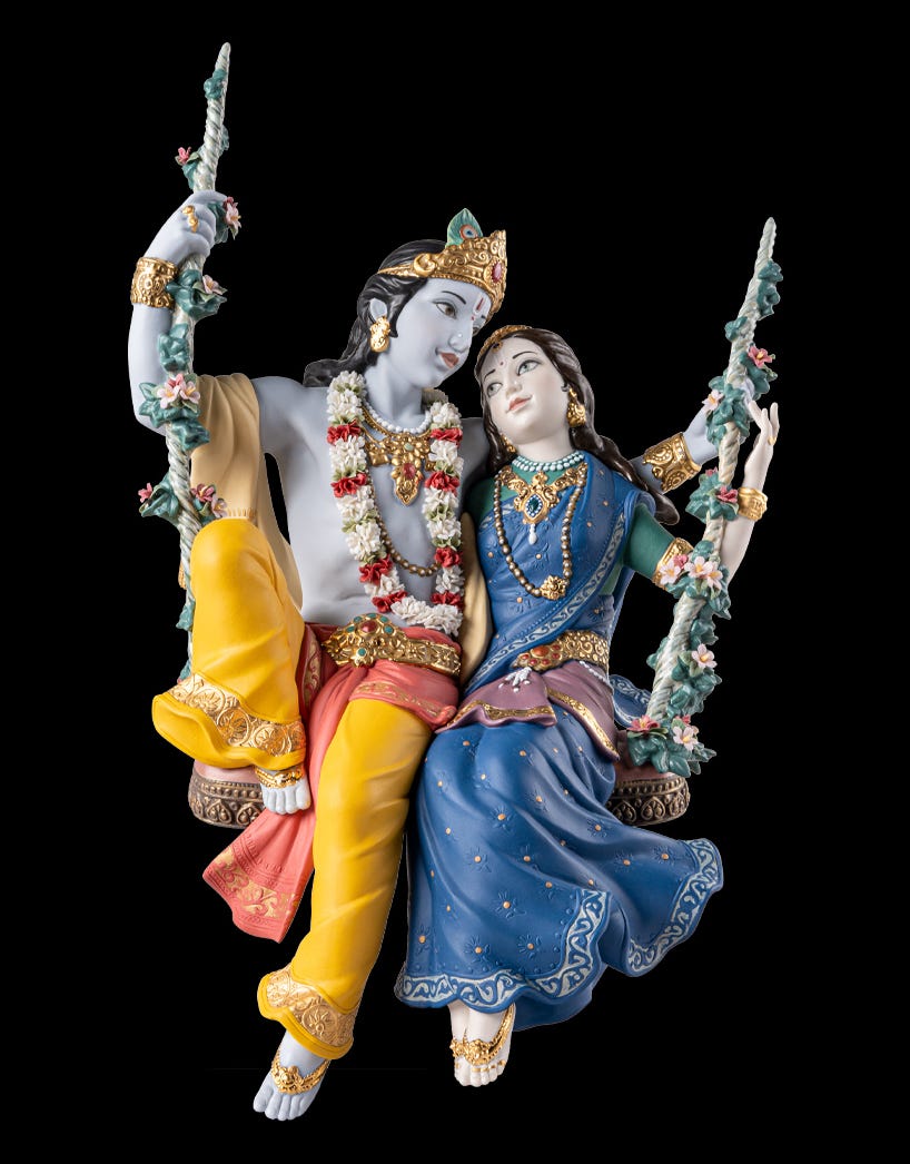 Front view of the Radha and Krishna on a swing sculpture