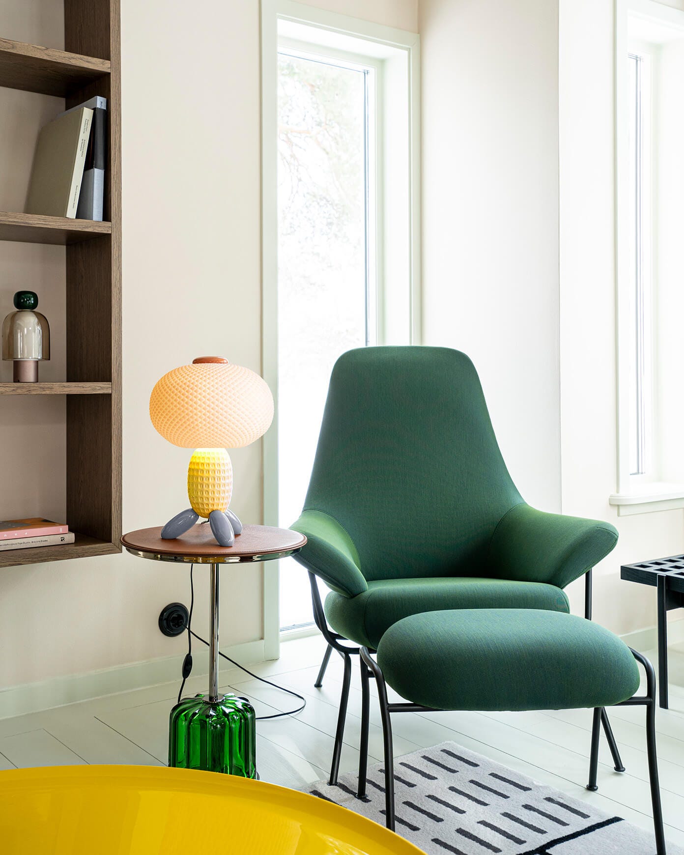 Yellow Soft Blown table lamp decorating a modern reading nook